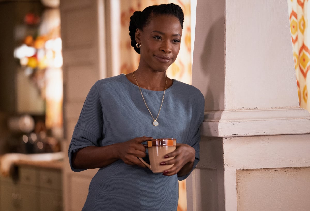 Karimah Westbrook holding a coffee cup in 'All American.'