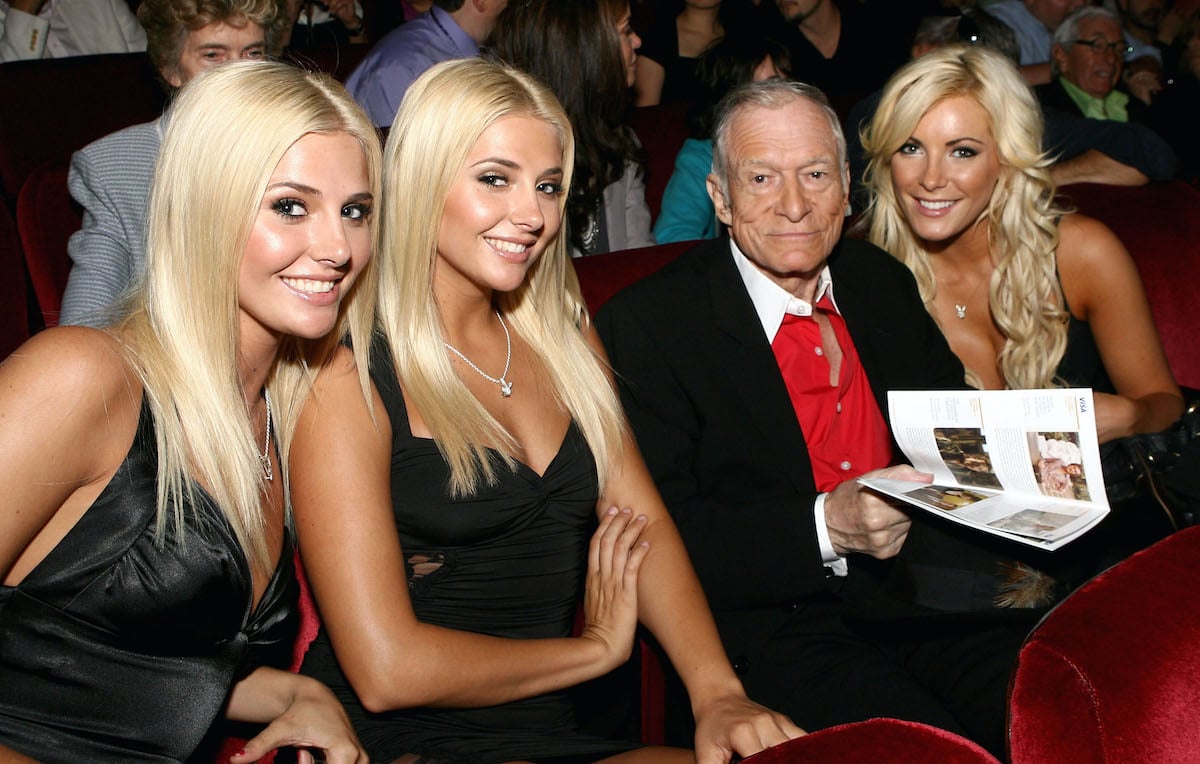 Hugh Hefner, Karissa Shannon, Kristina Shannon, and Crystal Harris sitting in a theater