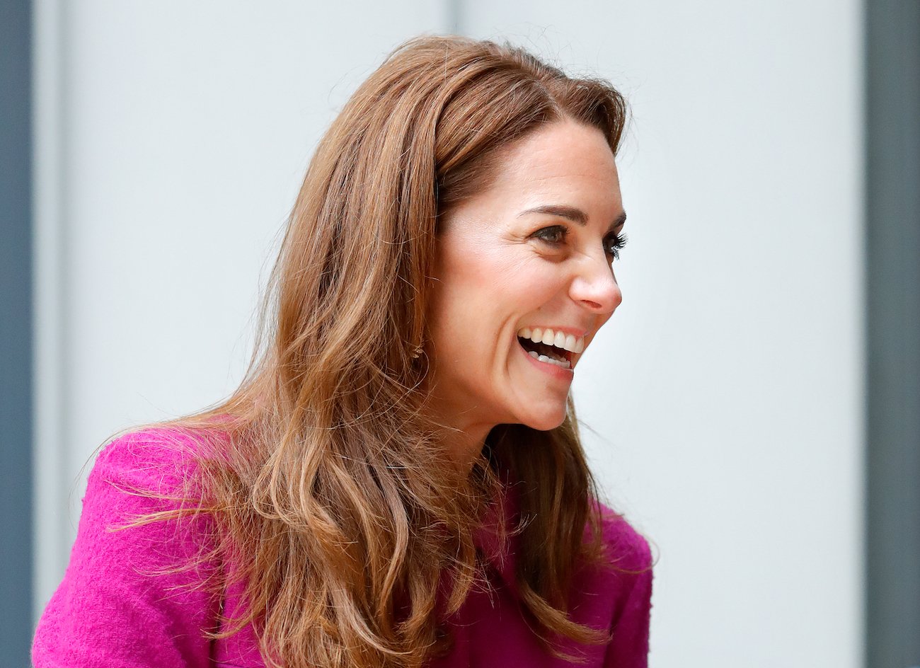 Kate Middleton laughing, looking to the side