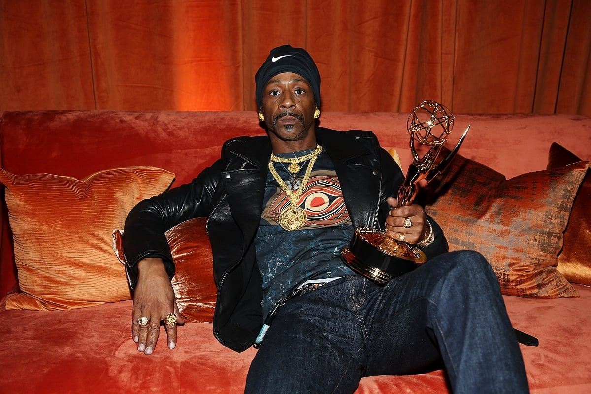 Katt Wiliams posing with an Emmy award.