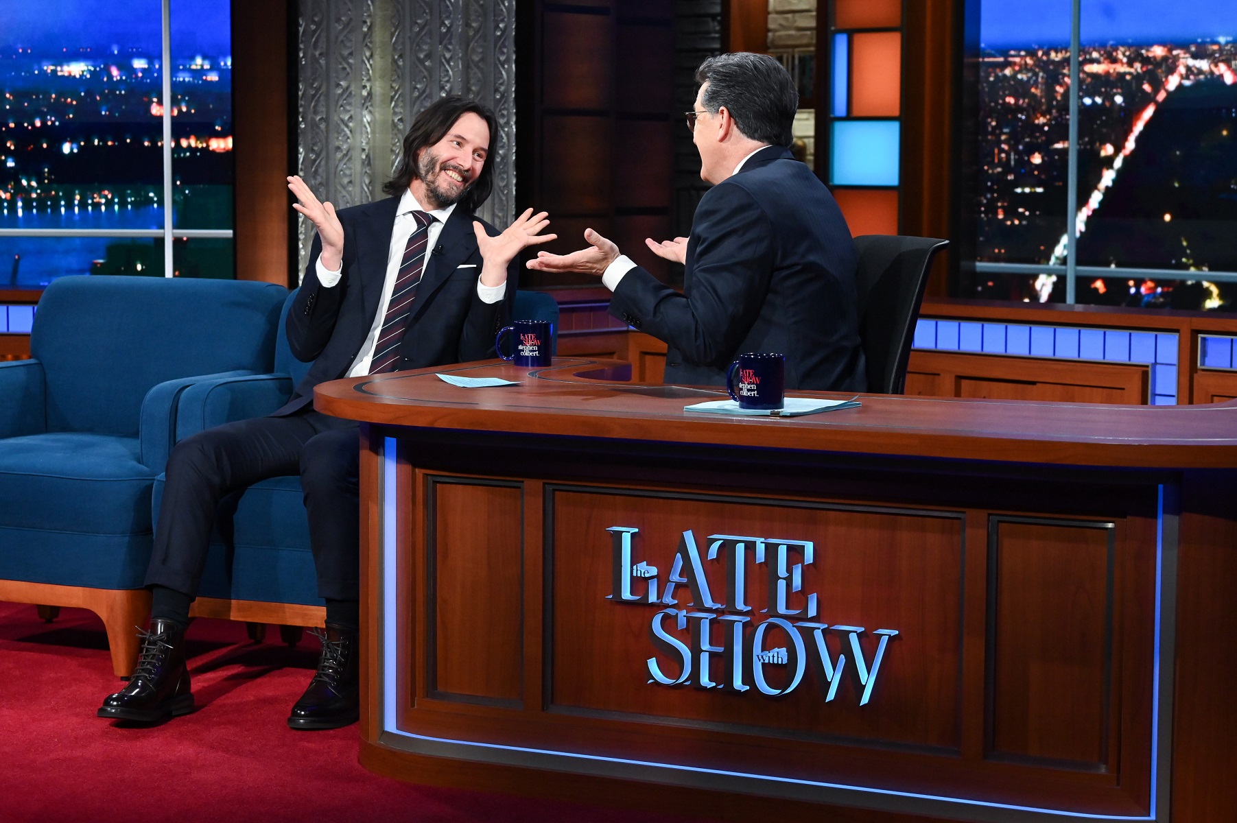 Keanu Reeves chats with Stephen Colbert on the set of 'The Late Show' on Dec. 13, 2021