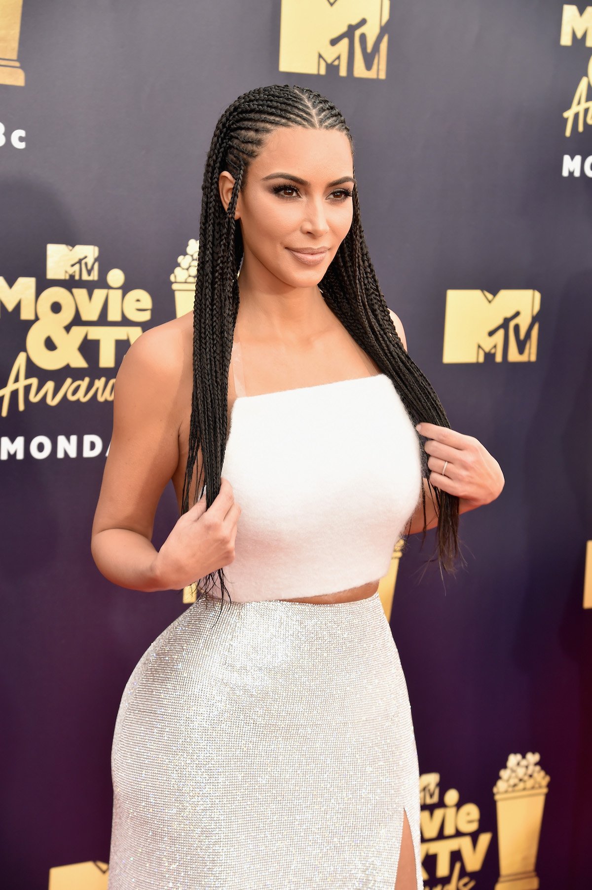 Kim Kardashian West wears long braids to an event.