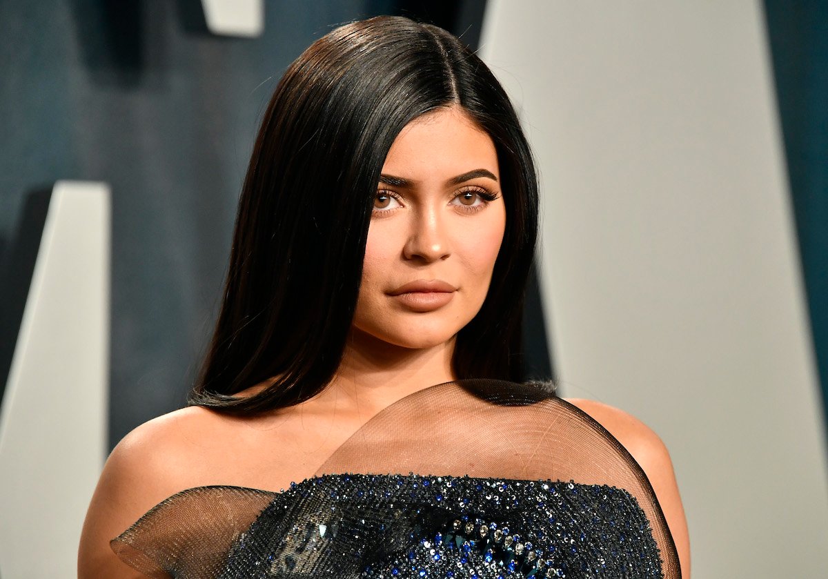 Kylie Jenner in front of a blue and white background