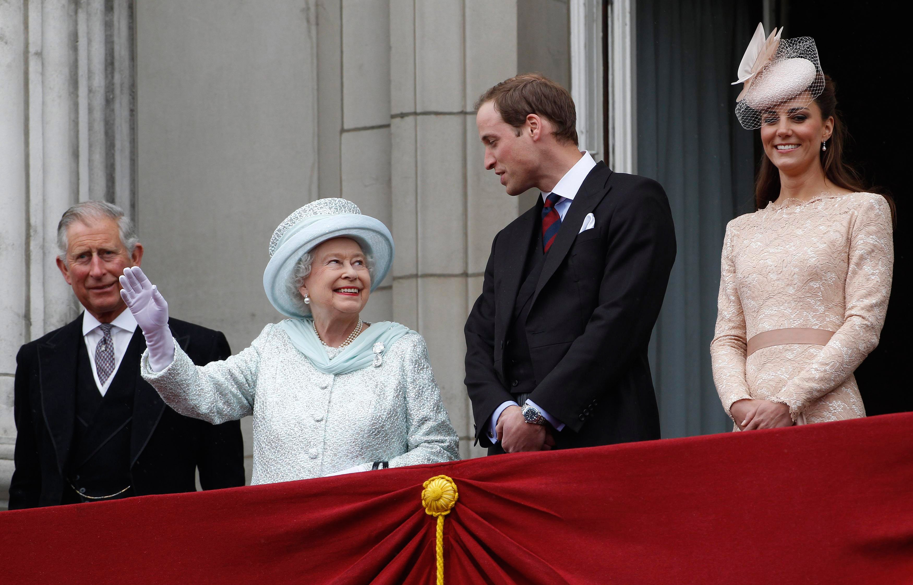 (L to R): Prince Charles, Queen Elizabeth II, Prince William, and Kate Middleton standing on the Buckingham Palace balcony during the finale of the Queen's Diamond Jubilee celebrations