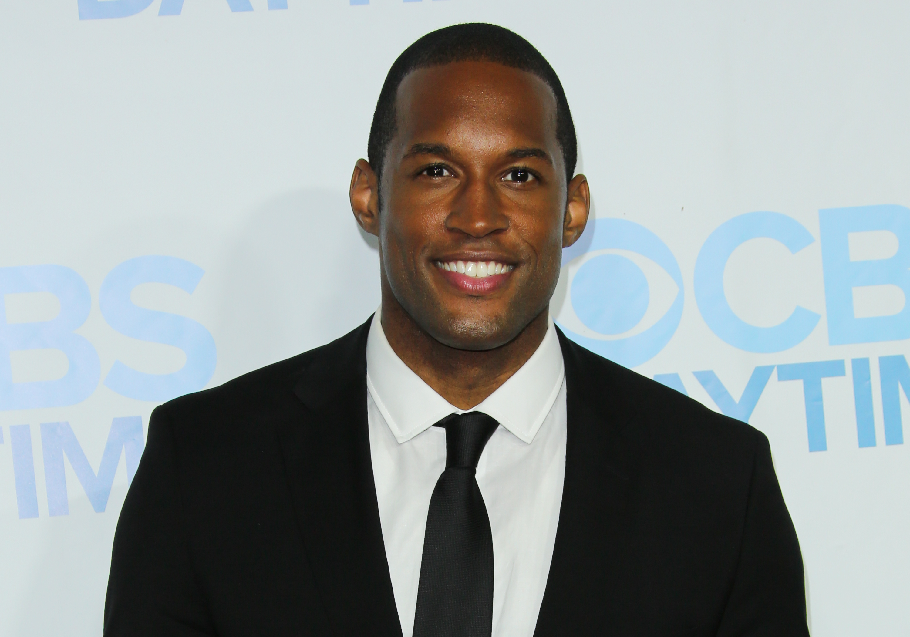 'The Bold and the Beautiful' actor Lawrence Saint-Victor dressed in a tuxedo during a red carpet appearance.