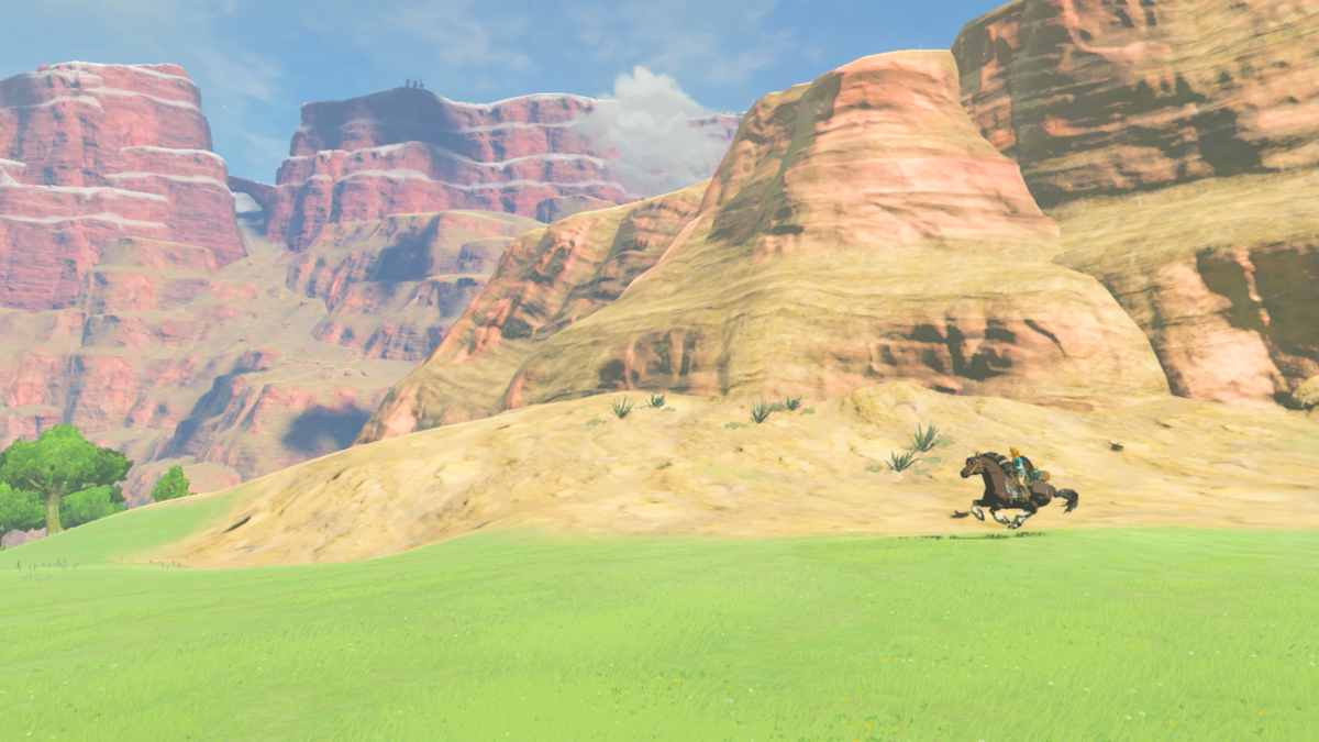 Link in a screenshot from 'The Legend of Zelda: Breath of the Wild' Satori Mountain in the background