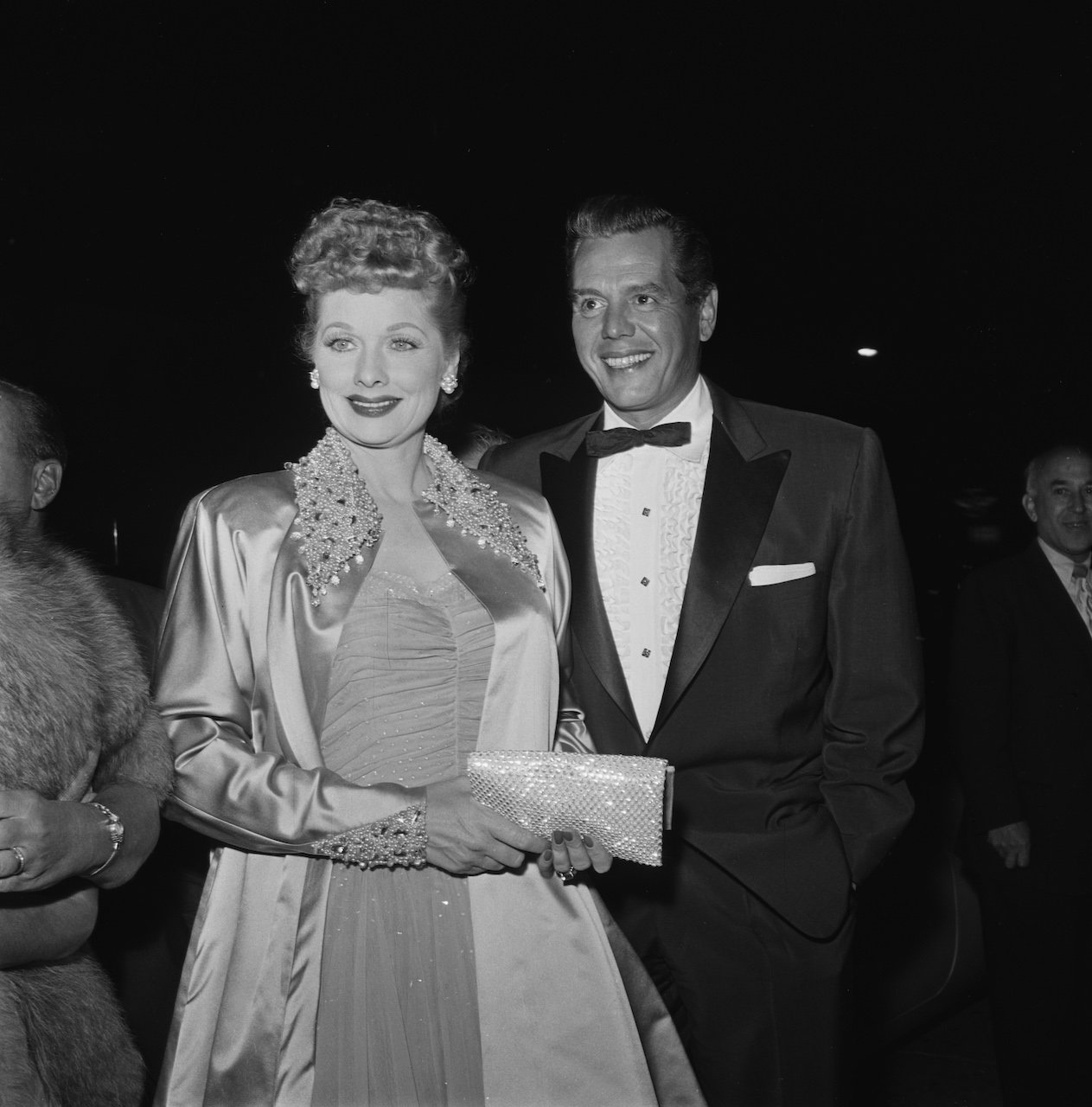 Lucille Ball and her husband Desi Arnaz attending a formal event