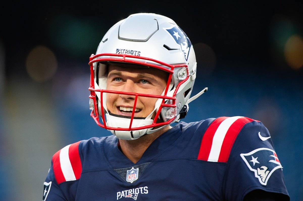 Mac Jones smiling during warm ups ahead of a preseason game