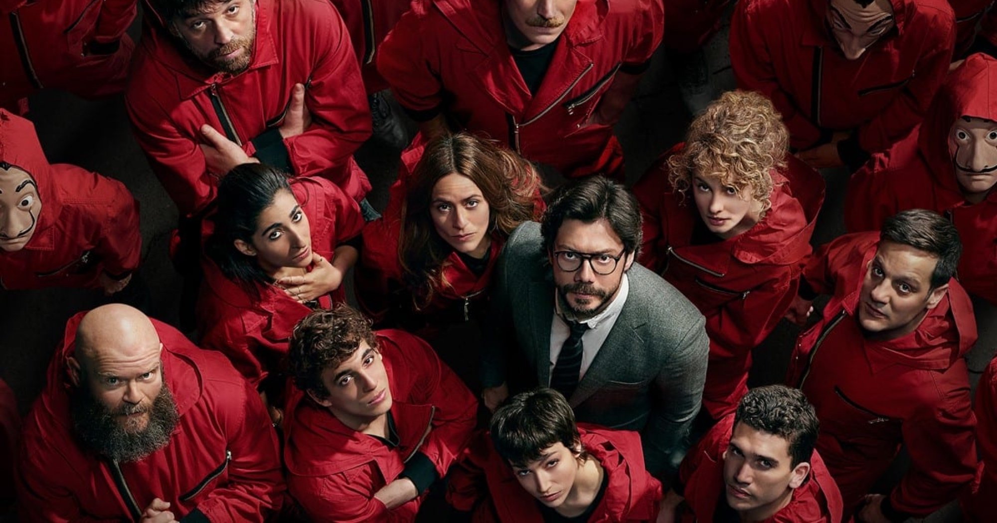 Main characters of 'Money Heist' crime drama in relation to K-drama remake wearing red jumpsuits.