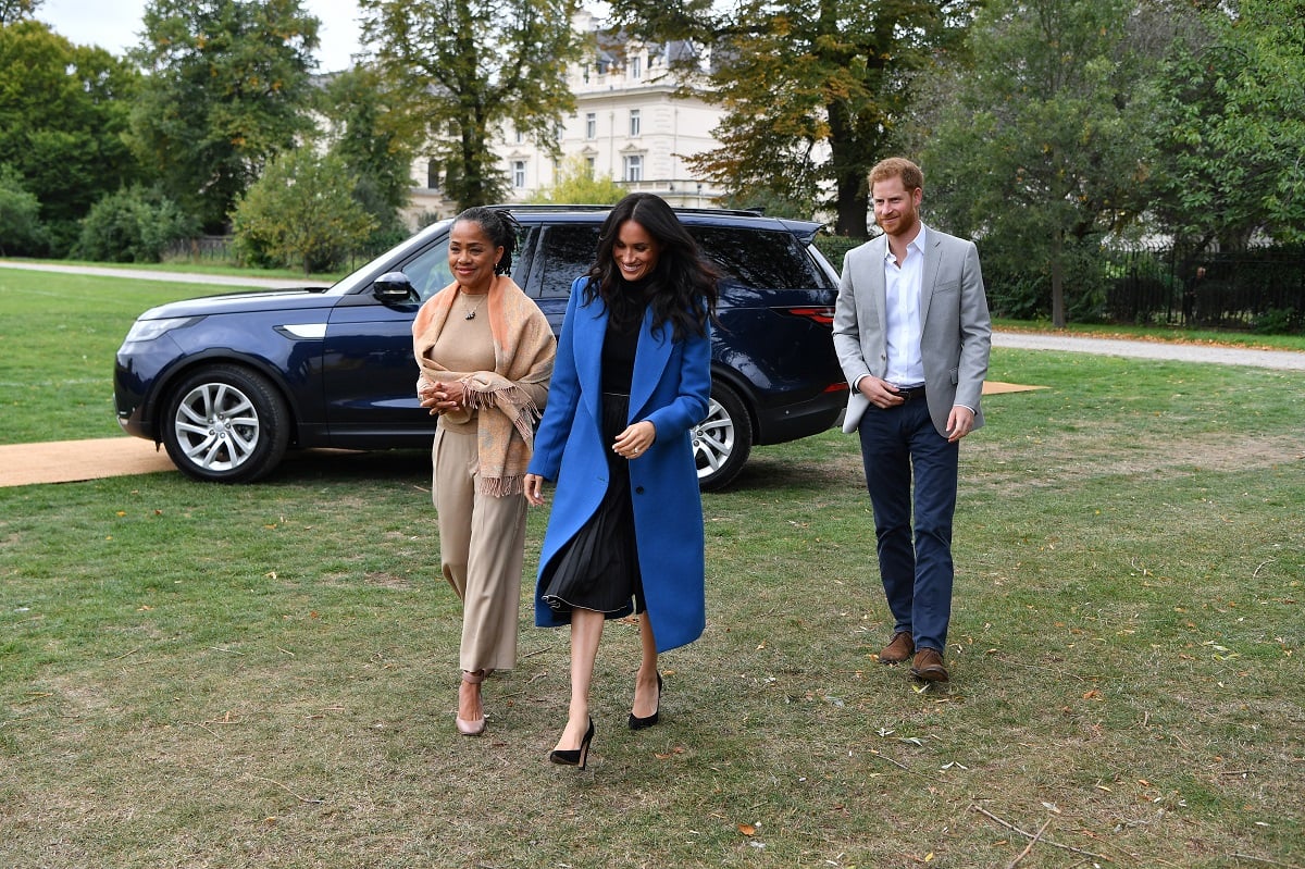 Meghan Markle, Doria Ragland, and Prince Harry at a cookbook launch event