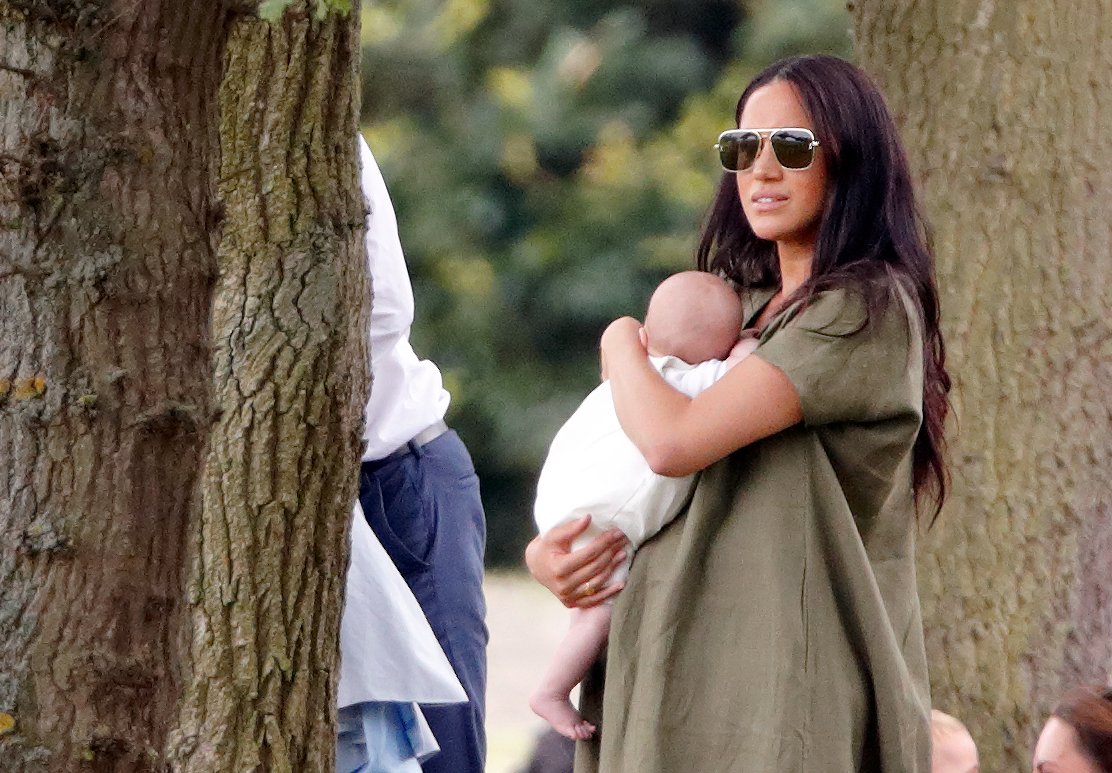 Meghan Markle holding Archie Harrison Mountbatten-Windsor at charity polo match