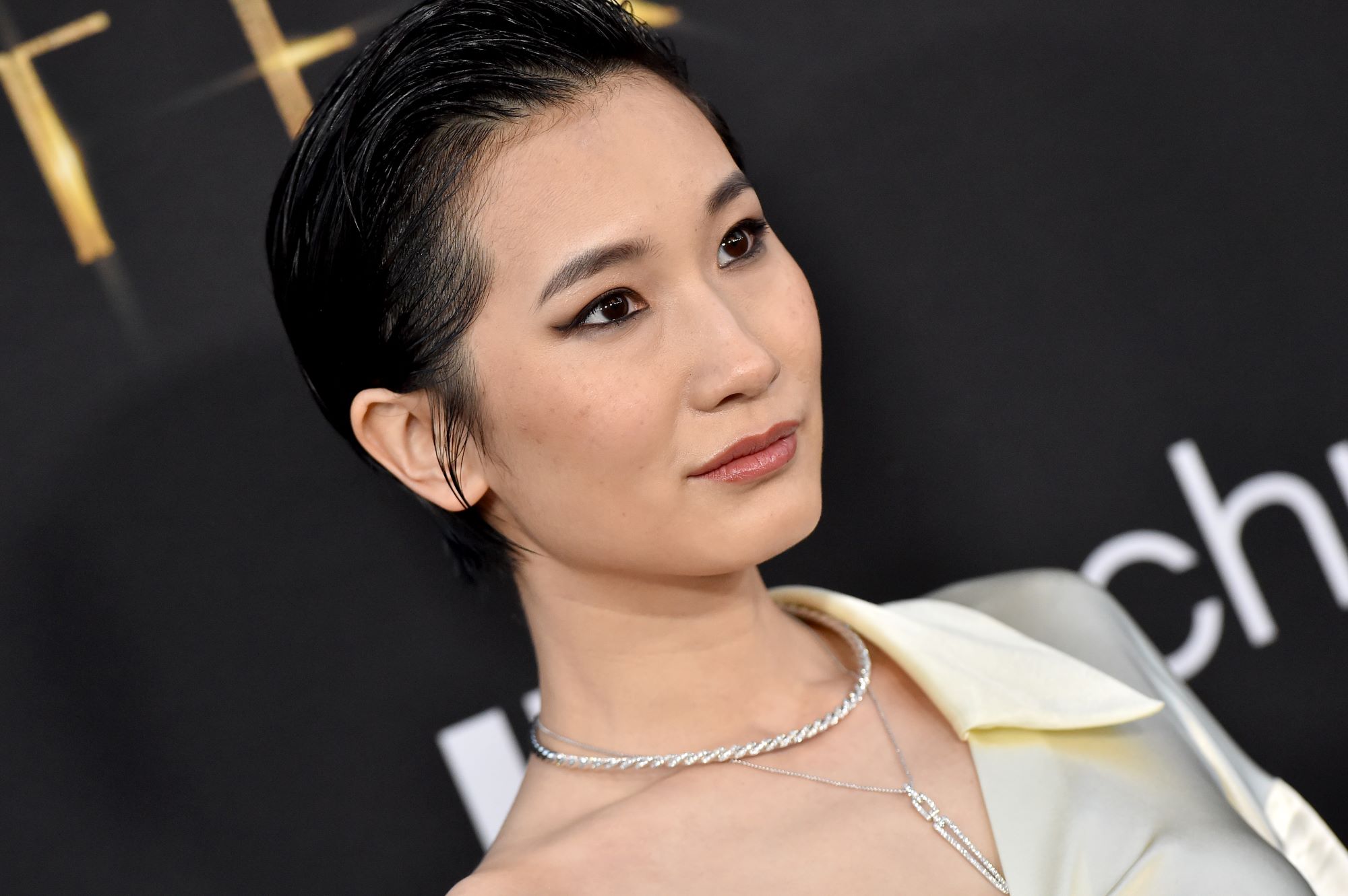 'Shang-Chi' star Meng'er Zhang, who may be in the sequel, wears a white blouse and a layered silver necklace.