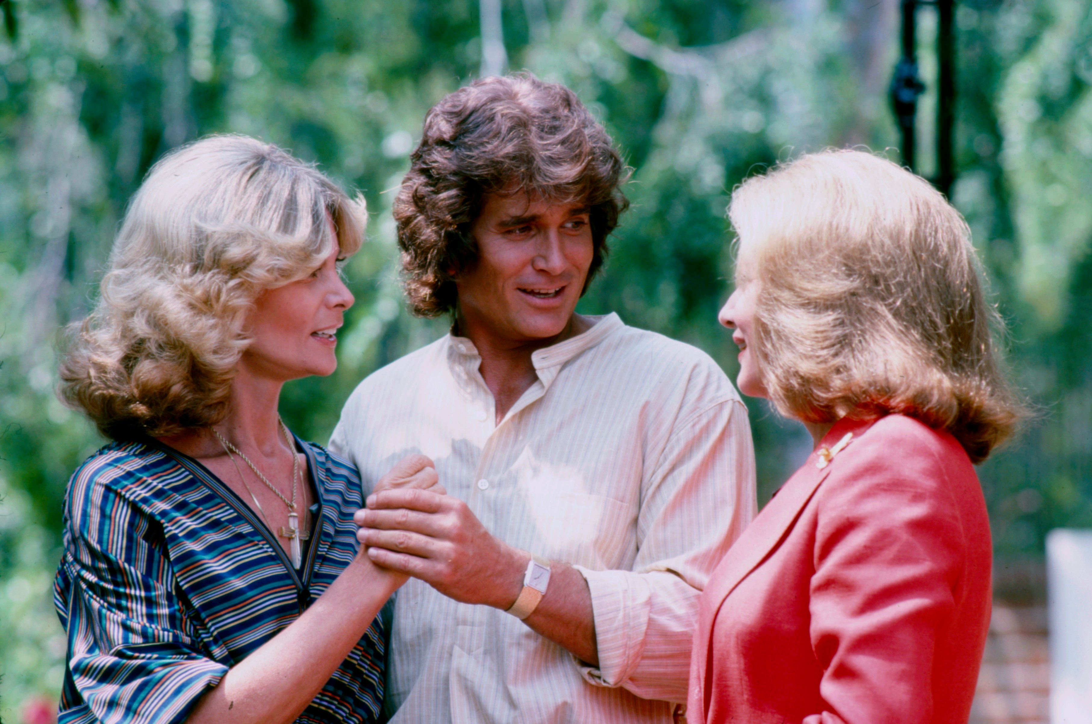 Michael Landon holds Lynn Noe's hand while Barbara Walters talks to them.