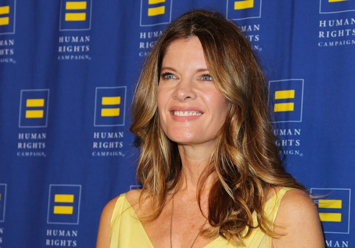 'The Young and the Restless' actor Michelle Stafford wearing a yellow dress, and posing on the red carpet.