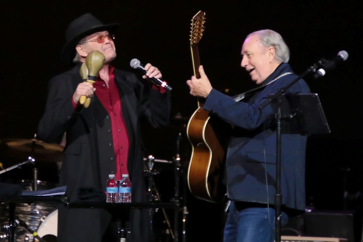 Micky Dolenz shakes maracas and Michael Nesmith plays a guitar 