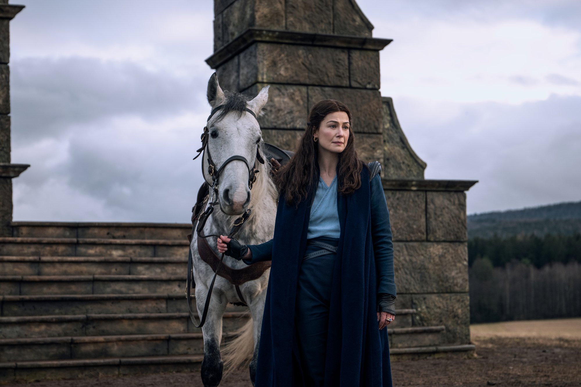 Rosamund Pike as Moiraine Damodred in Prime Video's 'The Wheel of Time' TV series. She's standing with her horse.