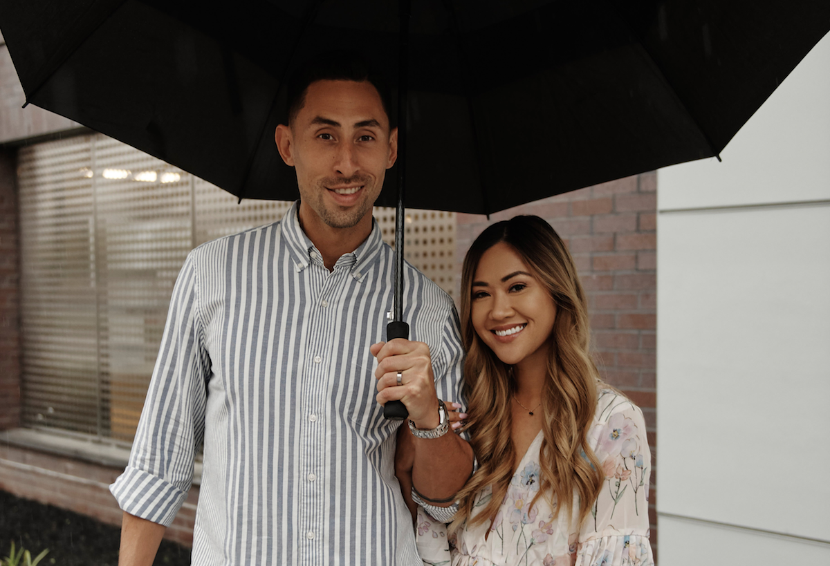 'Married at First Sight' couple Steve and Noi standing under an umbrella