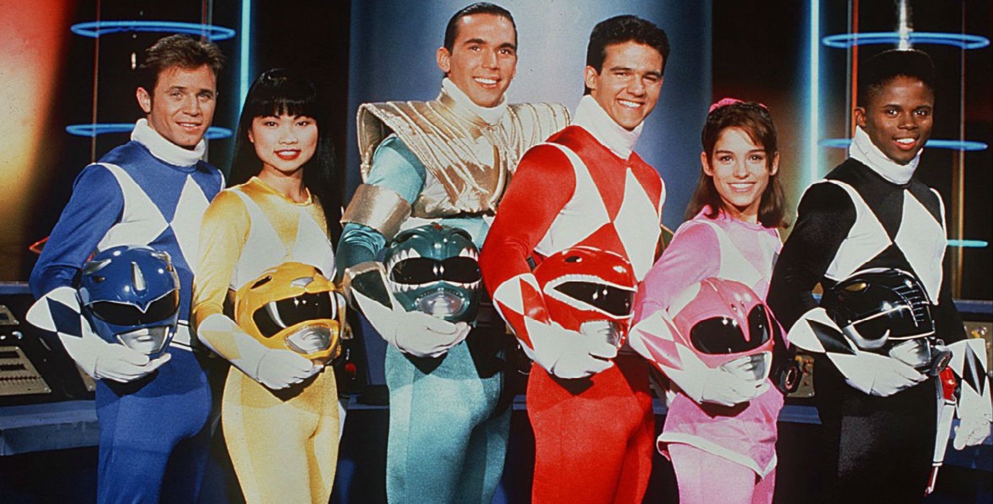 Original cast of 'Mighty Morphin Power Rangers' and franchise curse holding their helmets.