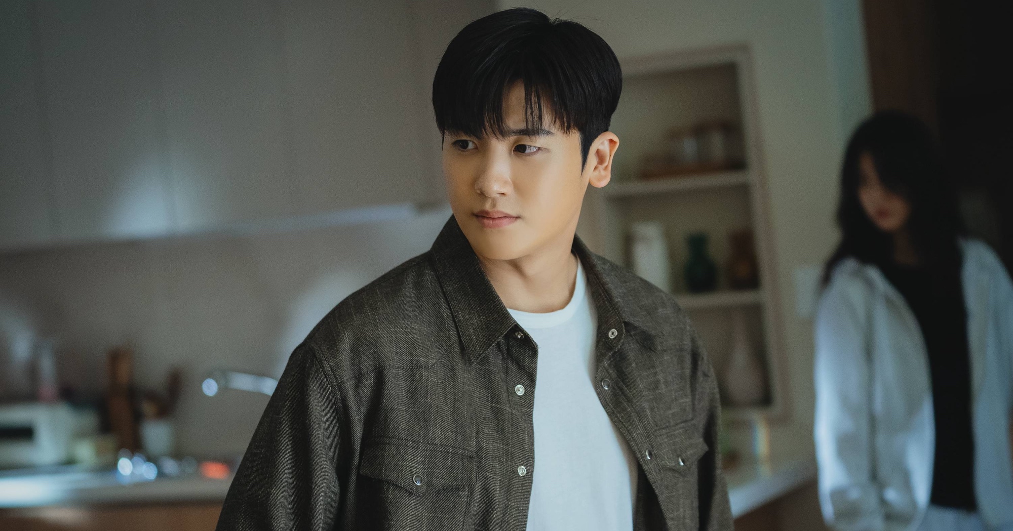 Park Hyung-sik in 'Happiness' K-drama wearing grey shirt and green button-up.