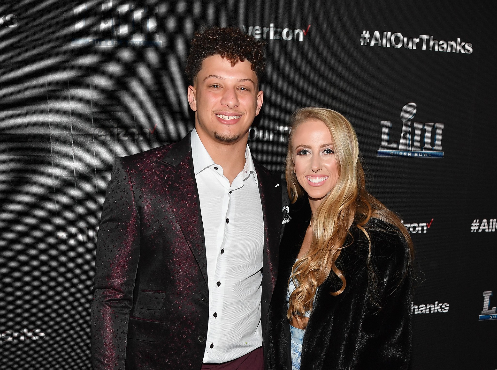 Patrick Mahomes and Brittany Matthews smiling for a photo as they arrive for premiere of 'The Team That Wouldn't Be Here' documentary