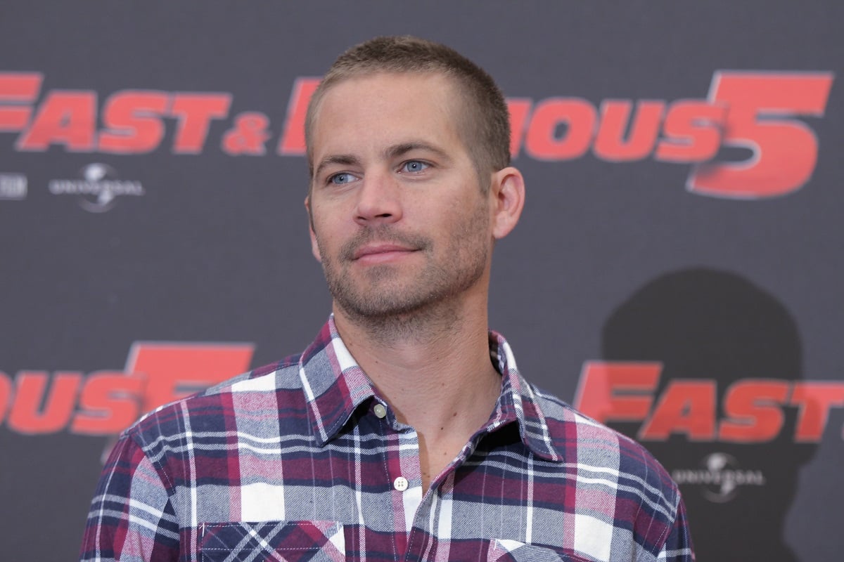 Paul Walker smirking in a plaid shirt.