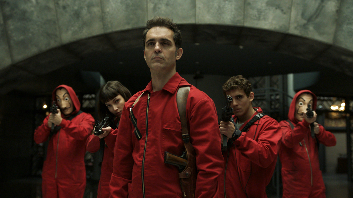 Pedro Alonso and the rest of the cast dressed in red jumpsuits in 'Money Heist.'