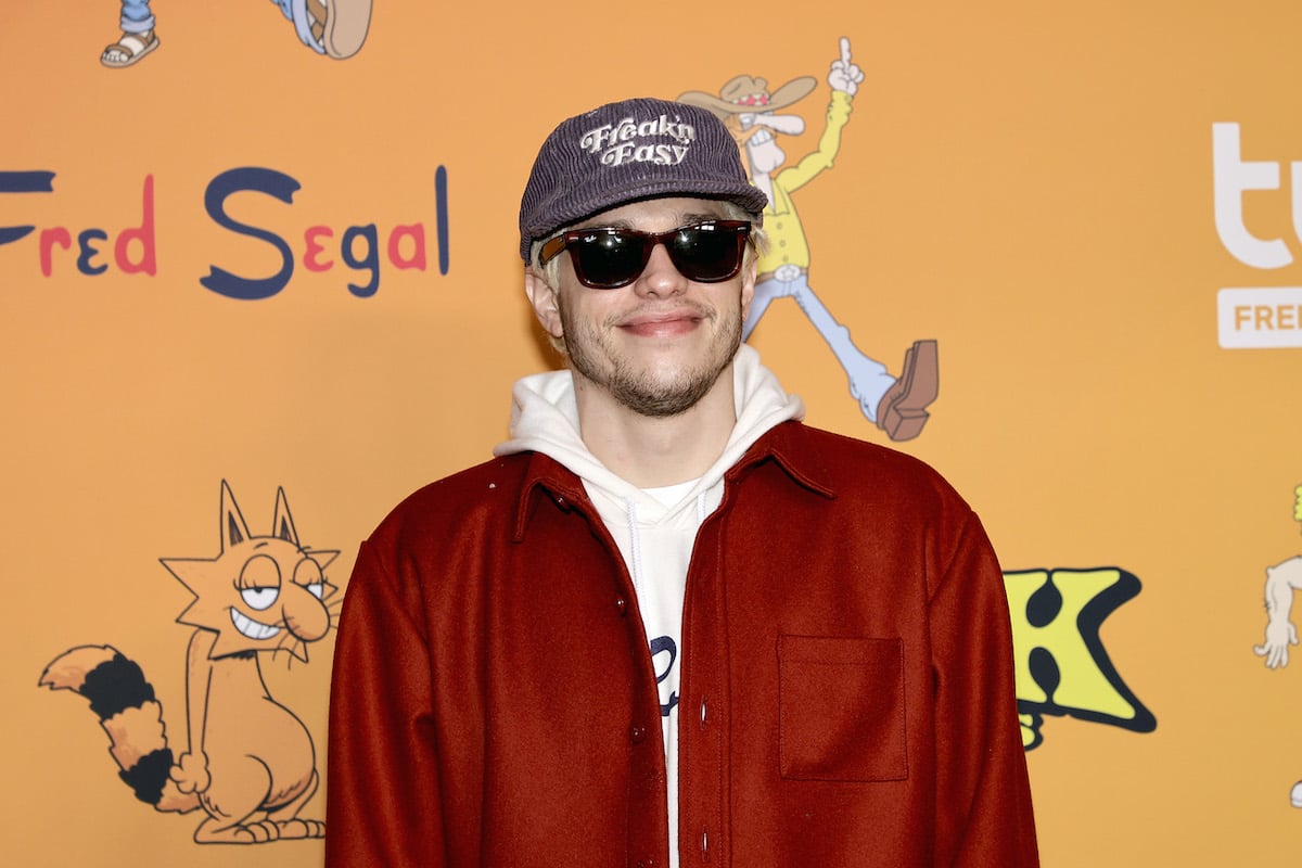 Pete Davidson smiles at an event.