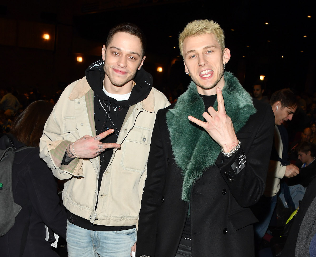 Pete Davidson and Machine Gun Kelly pose for the camera together.
