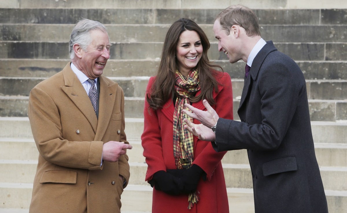 Prince Charles, Kate Middleton, and Prince William laughing and joking with one another during a visit to Dumfries House in Scotland