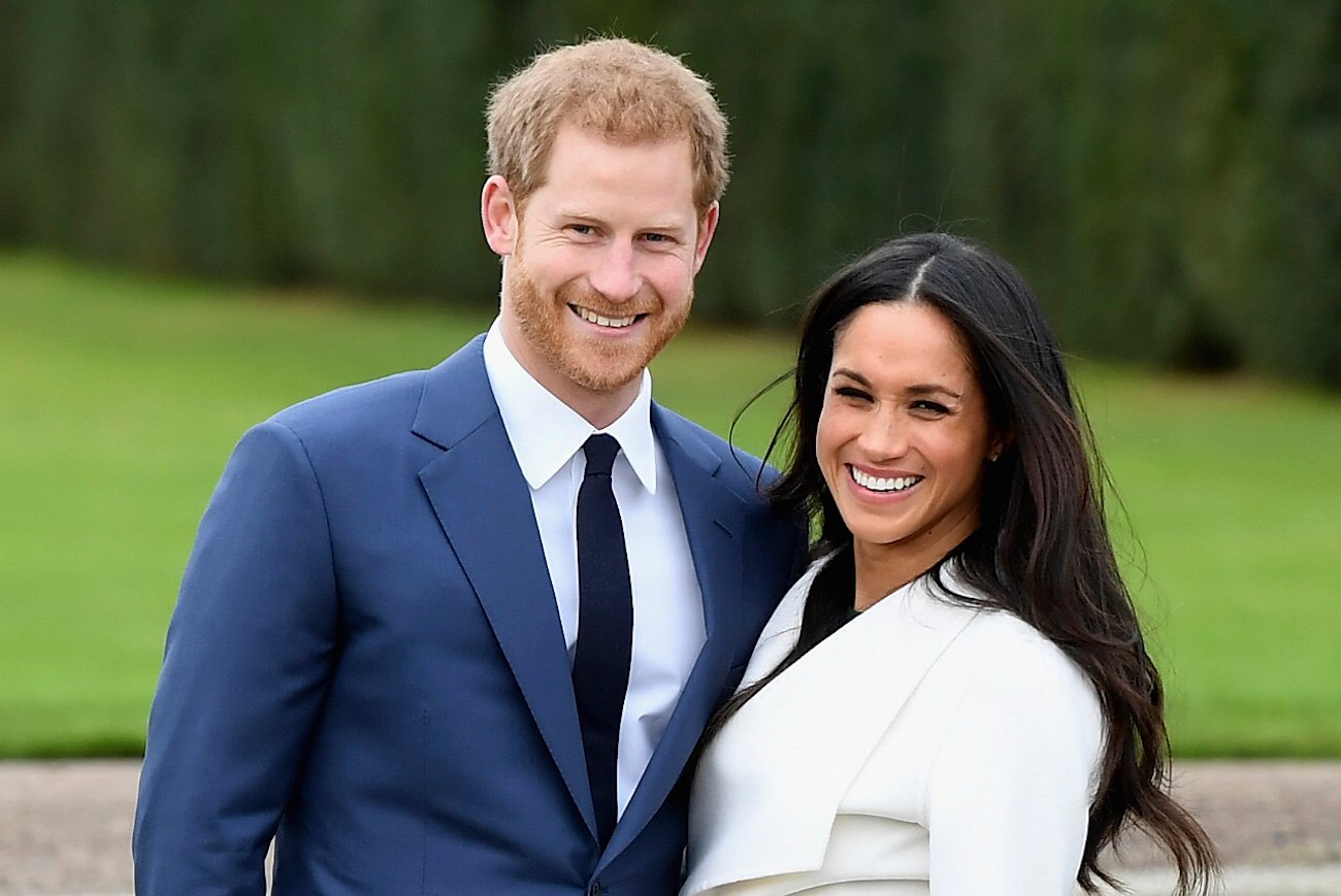 Prince Harry and Meghan Markle pose together and smile