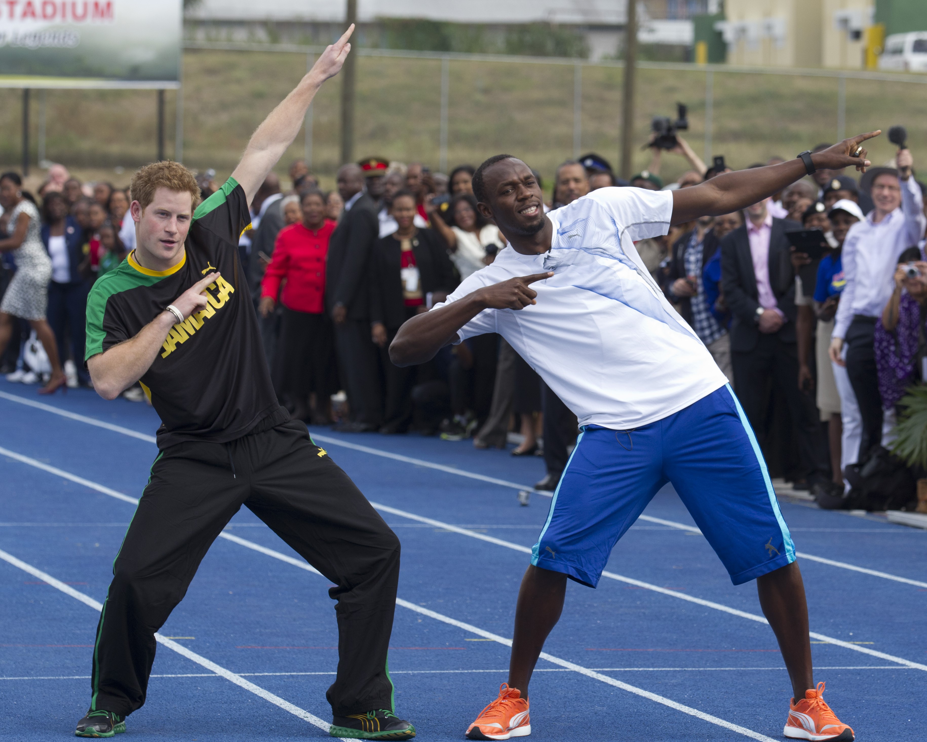 Prince Harry gets running tips from Usain Bolt at The University of the West Indies in Jamaica