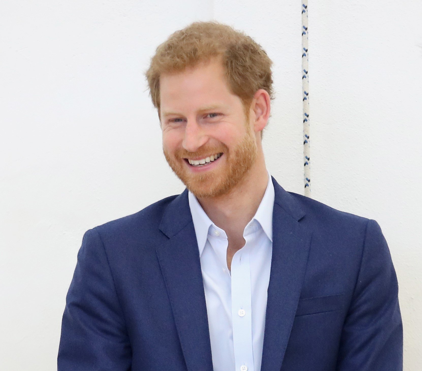 Prince Harry smiling while visiting the Danish Veteran Centre in Copenhagen