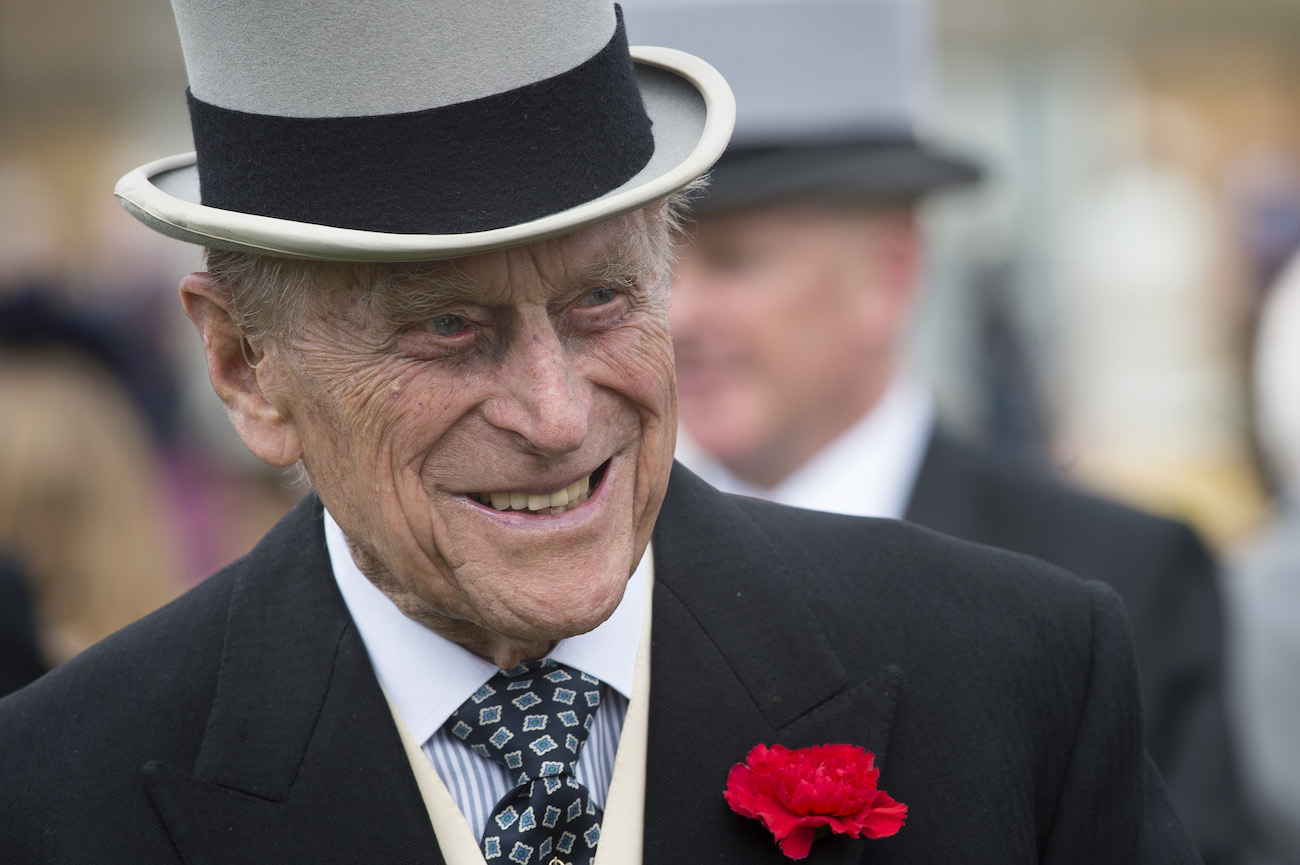 Prince Philip wearing a hat, smiling