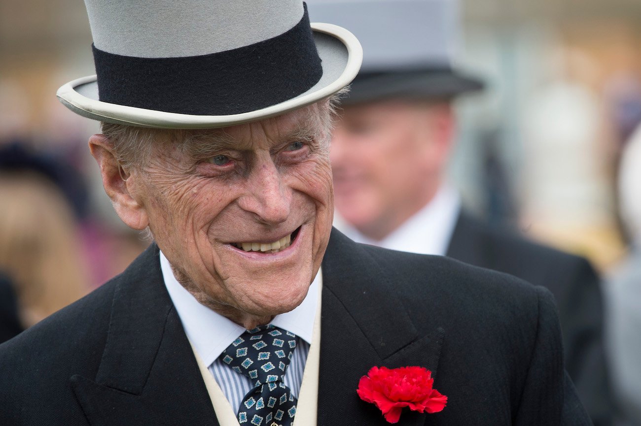 Prince Philip wearing a hat, smiling