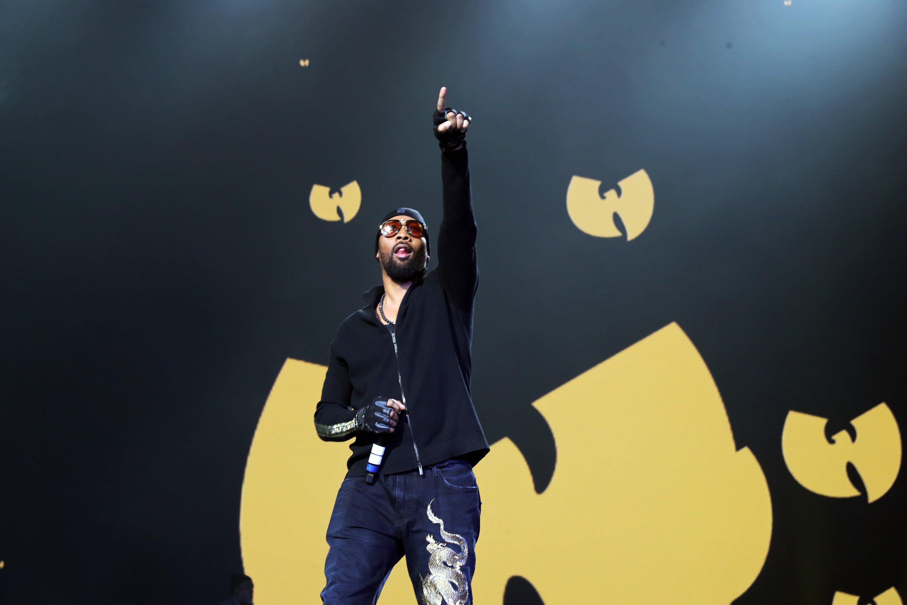 RZA performing with his hand up