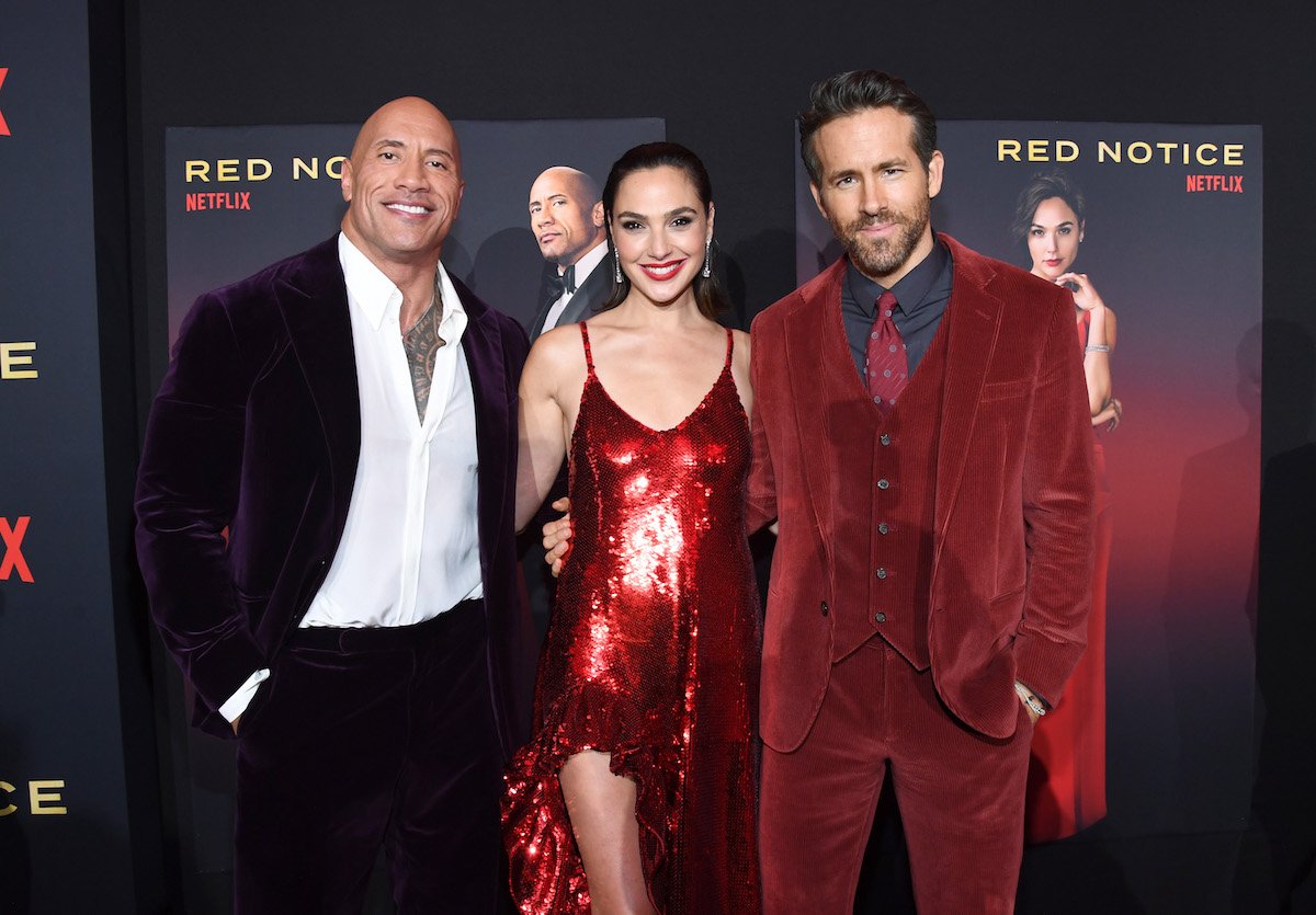 Red Notice stars Dwayne Johnson, Gal Gadot, and Ryan Reynolds at the Netflix movie's world premiere at Regal LA Live on November 3, 2021, in Los Angeles