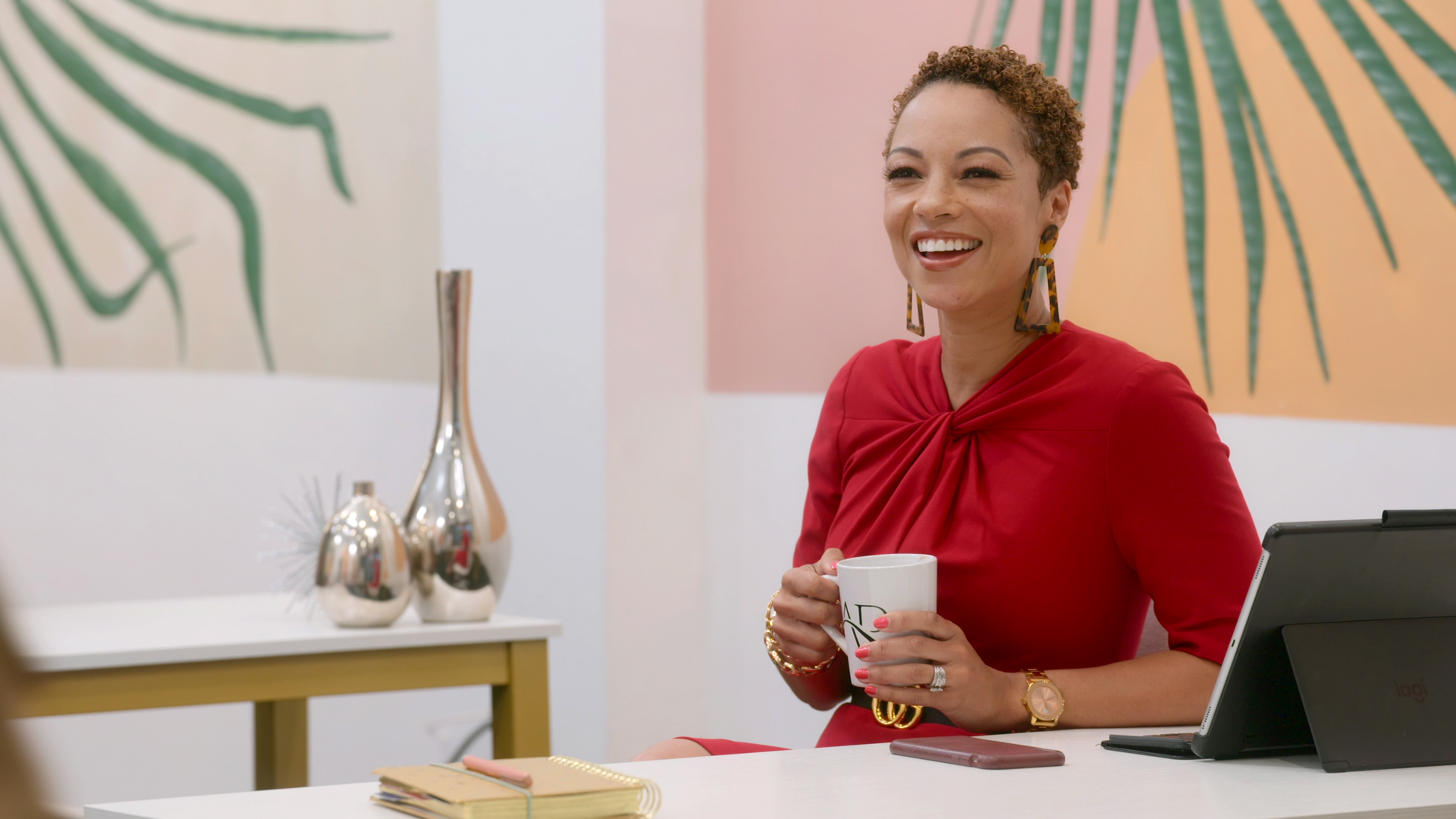 Rena Upshaw-Frazier sitting at her Allure Realty desk in Netflix's 'Selling Tampa'