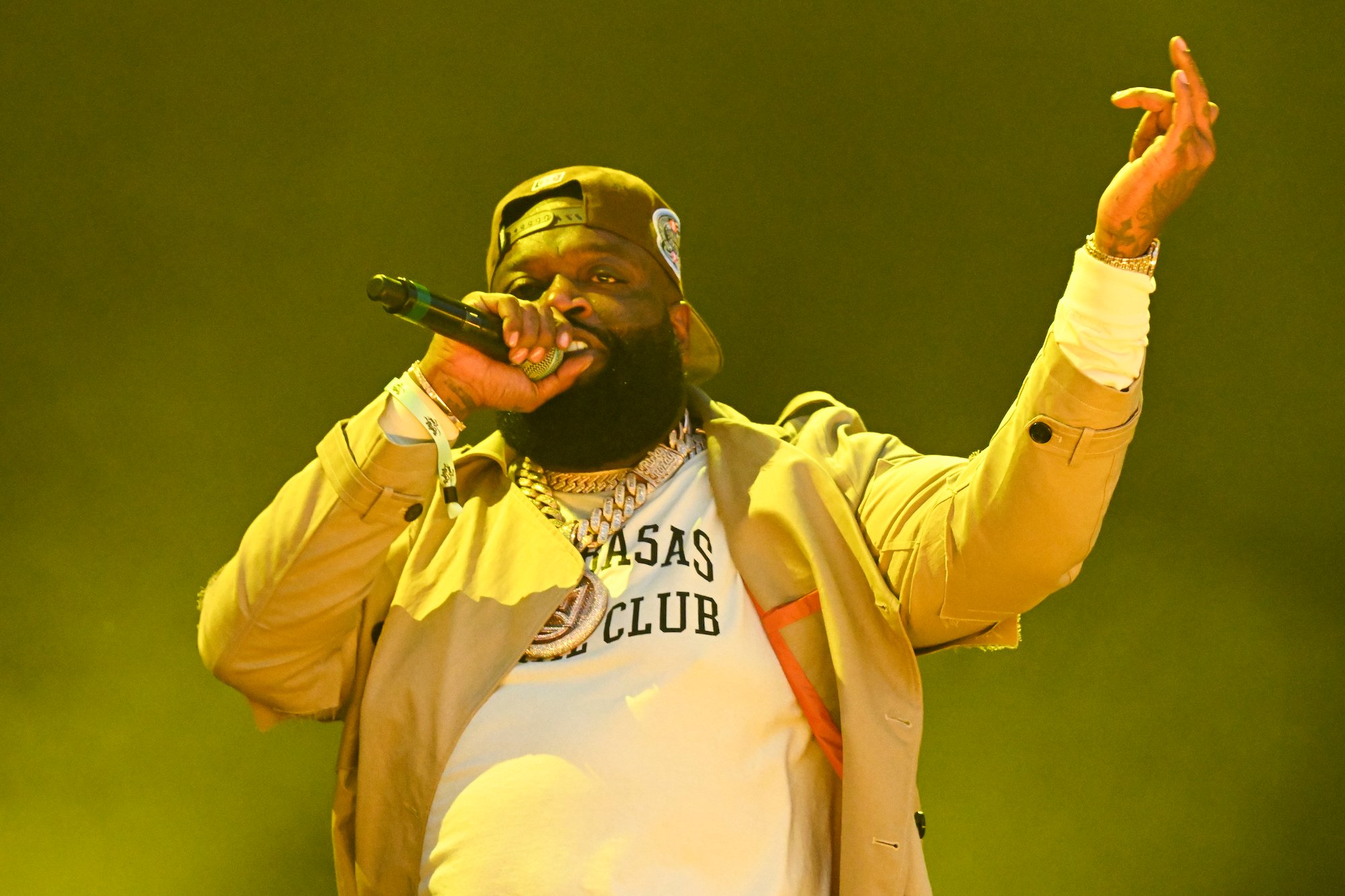 Rick Ross holding a mic and performing