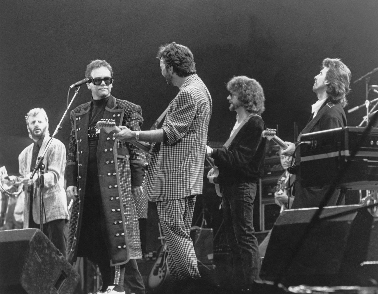 Ringo Starr, Elton John, Eric Clapton, Jeff Lynne, and George Harrison performing during the Prince's Trust concert in 1987.