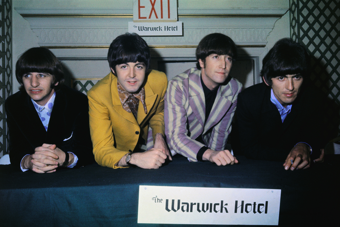 Ringo Starr, Paul McCartney, John Lennon, and George Harrison at a press conference at the Warwick Hotel in 1966.