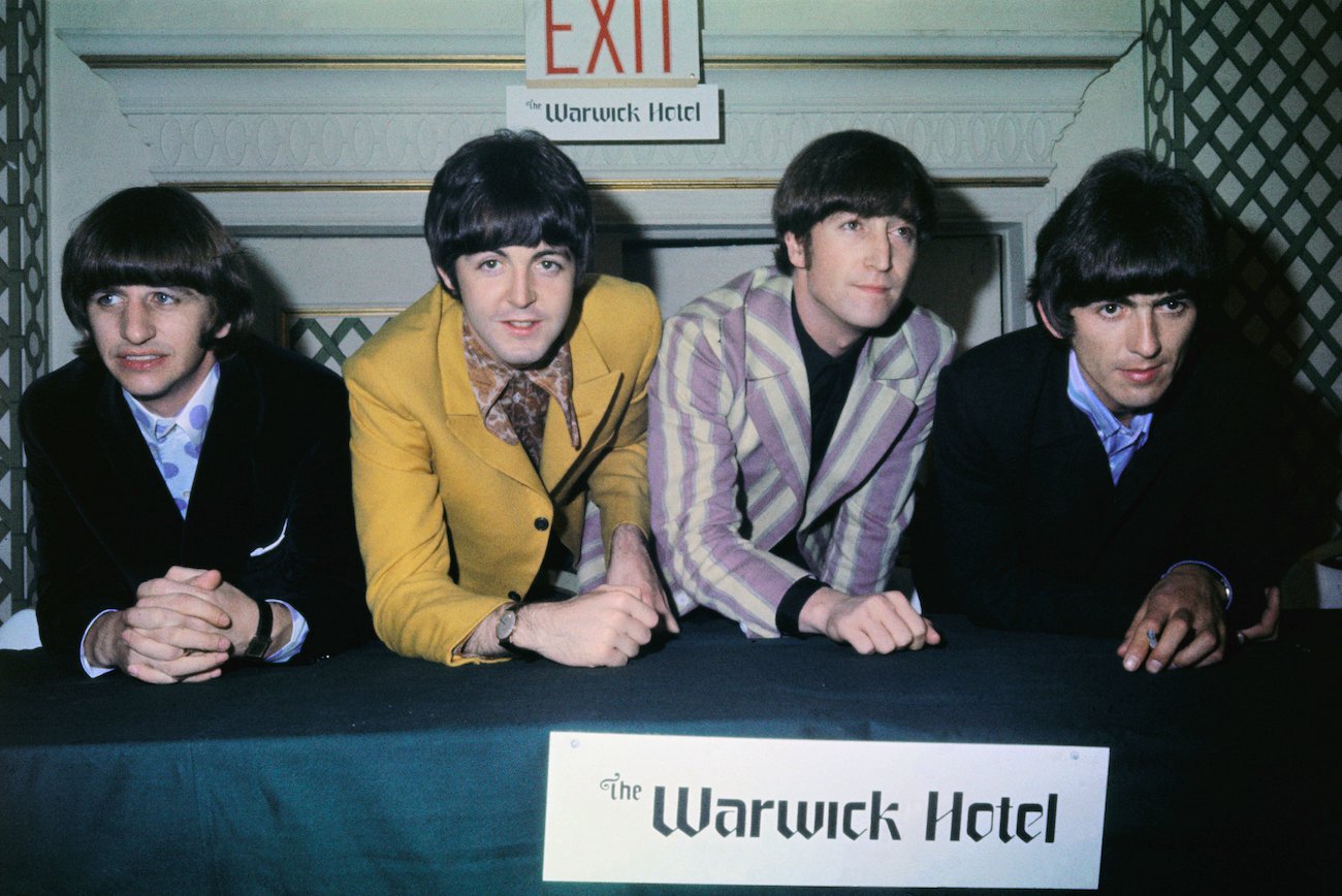 Ringo Starr, Paul McCartney, John Lennon, and George Harrison at a press conference at the Warwick Hotel in 1966.