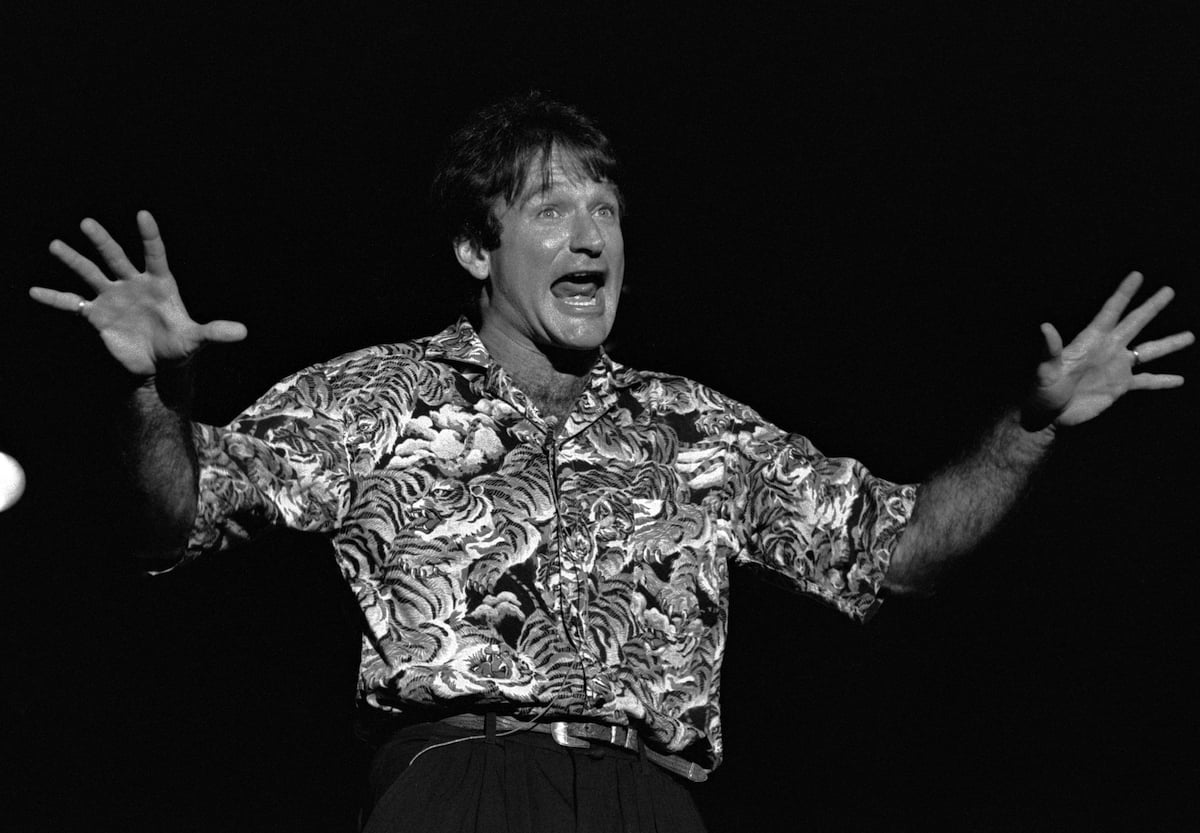 Comedian Robin Williams performing standup in black and white