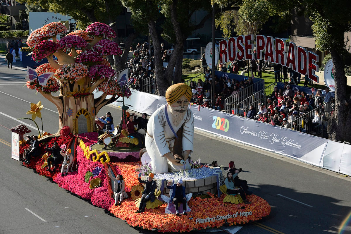 A float in the 2020 Rose Parade with a Rose Parade sign in the background