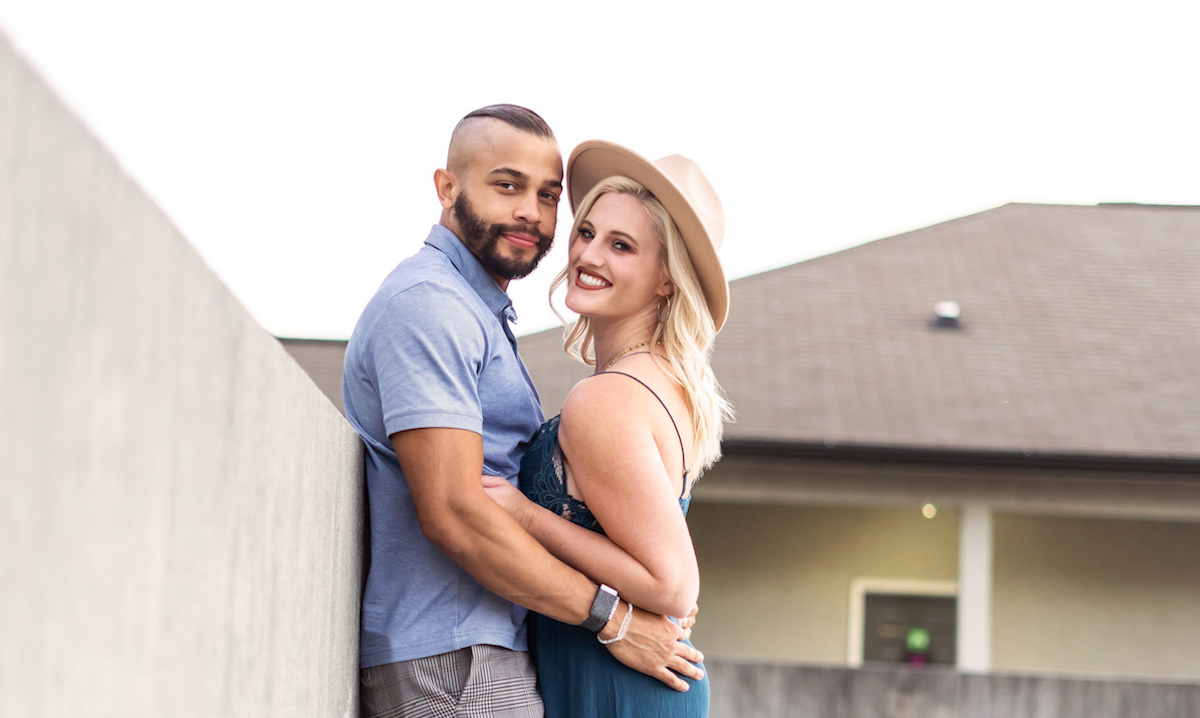 Ryan, wearing a blue shirt, and Clara, wearing a straw hat, from 'Married at First Sight' Season 12