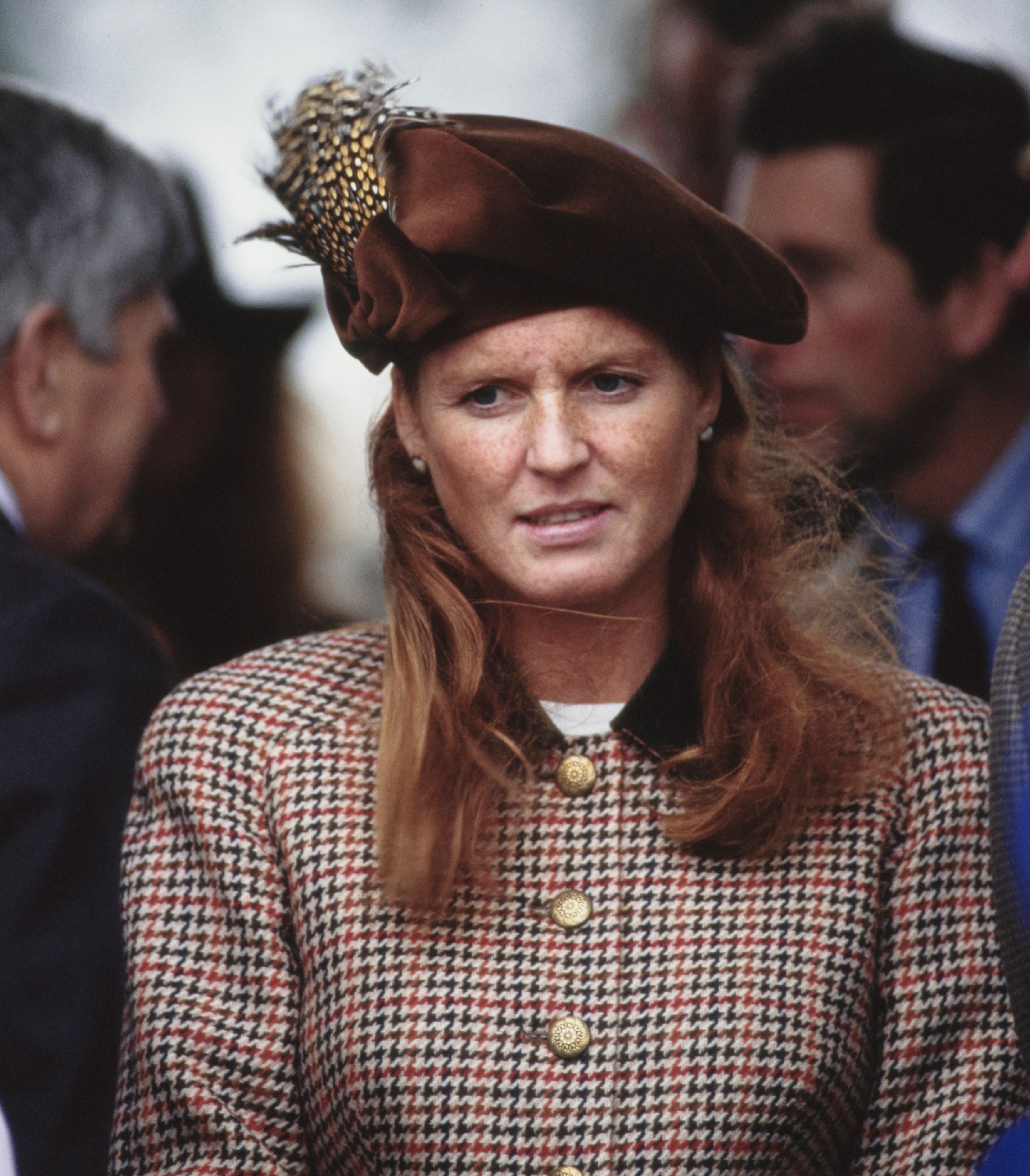 Sarah Ferguson wearing a tweed jacket with a black collar and a Tudor-style bonnet on Christmas