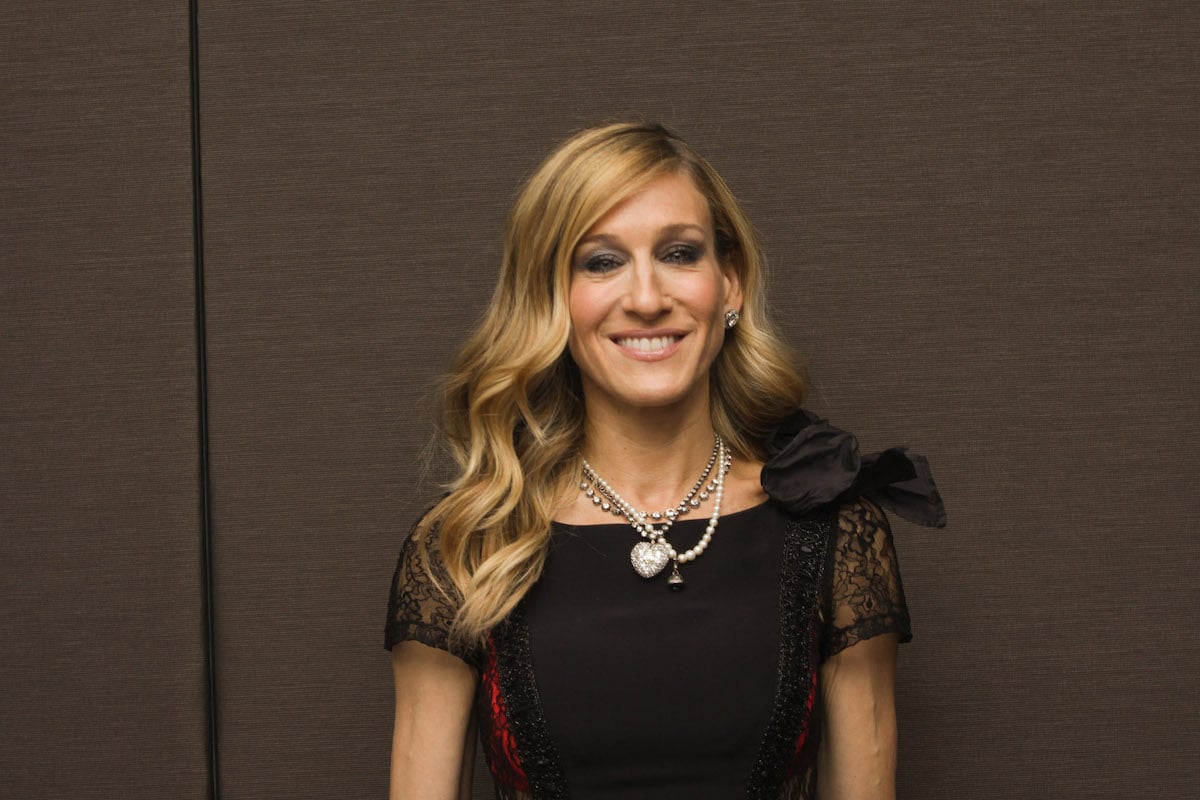 Sarah Jessica Parker smiles for the camera at an event.