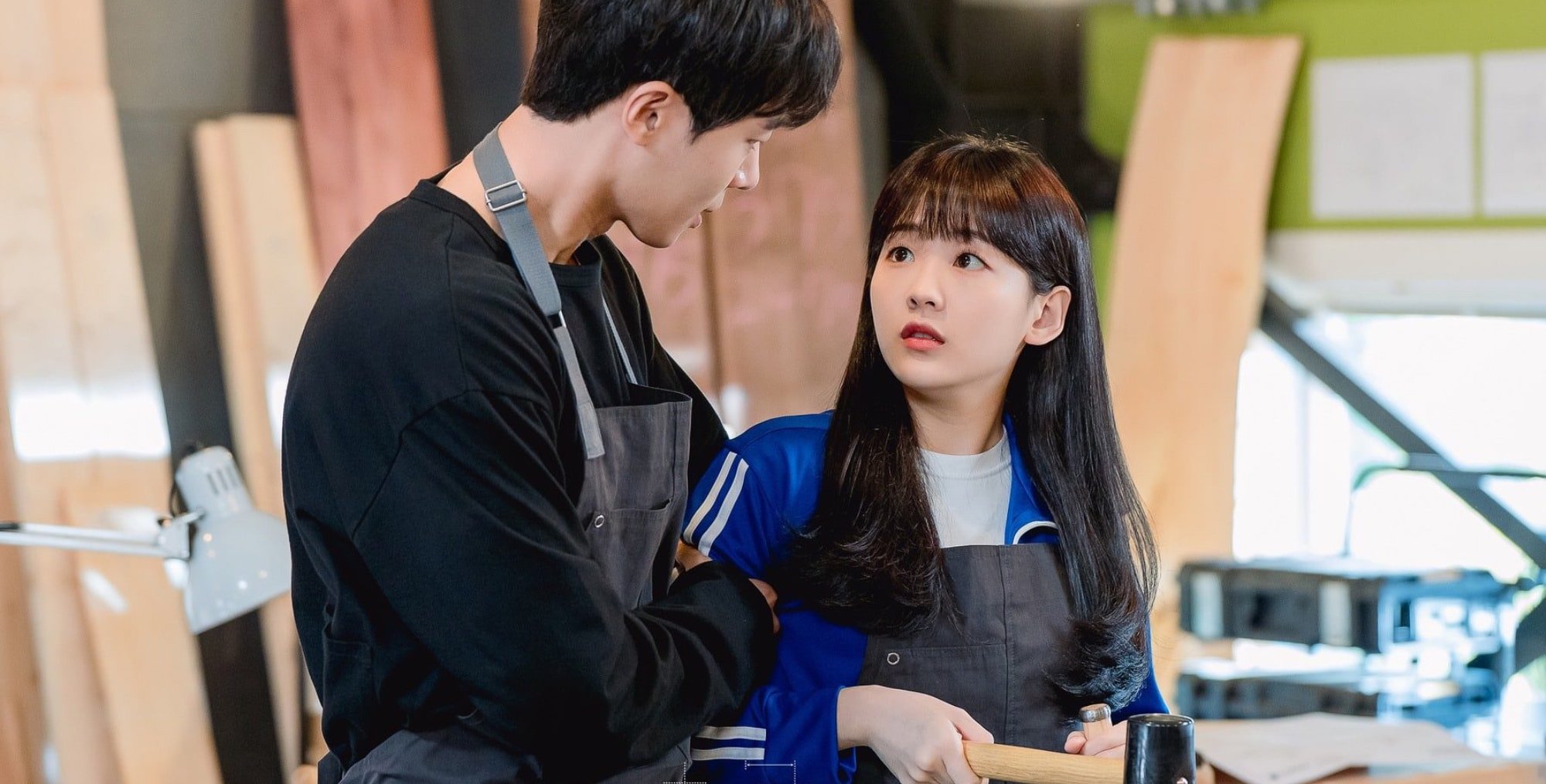 'School 2021' lead characters in a 2021 romance K-drama embracing each other.