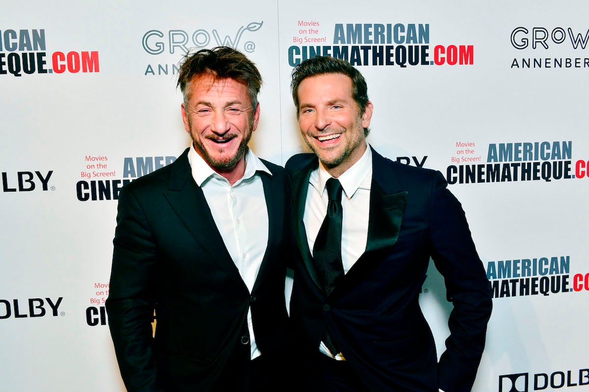 Sean Penn and Bradley Cooper pose for photos together at the 32nd American Cinematheque Award Presentation in 2018
