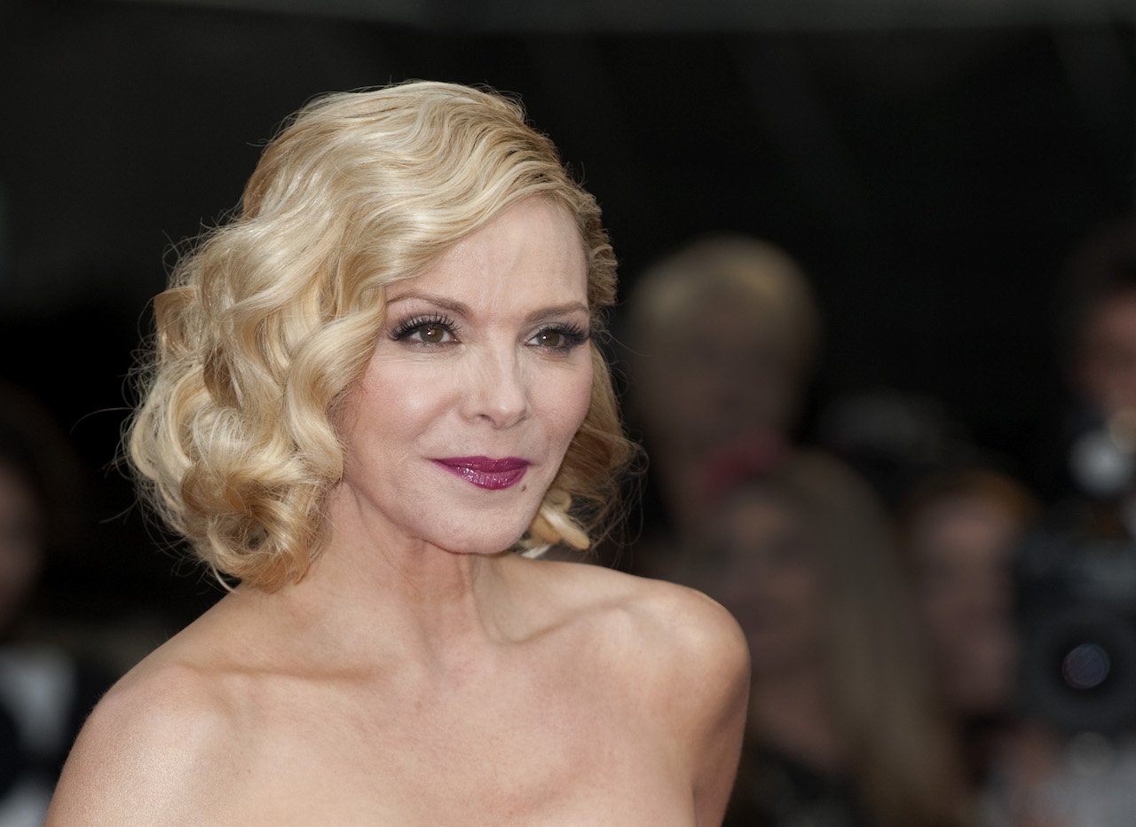 Kim Cattrall of 'Sex And The City 2' poses on the carpet in her hair up in curls.
