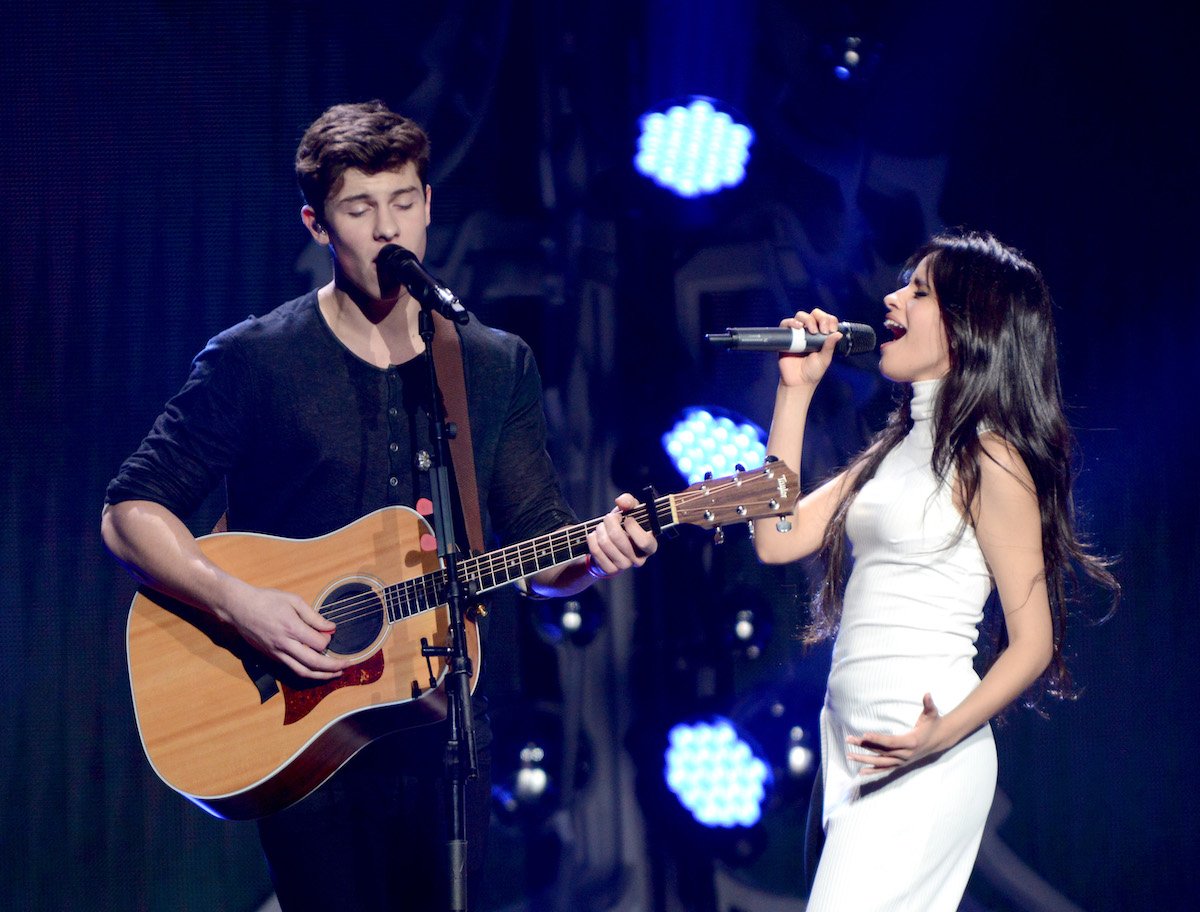 Shawn Mendes and Camila Cabello perform on stage together.